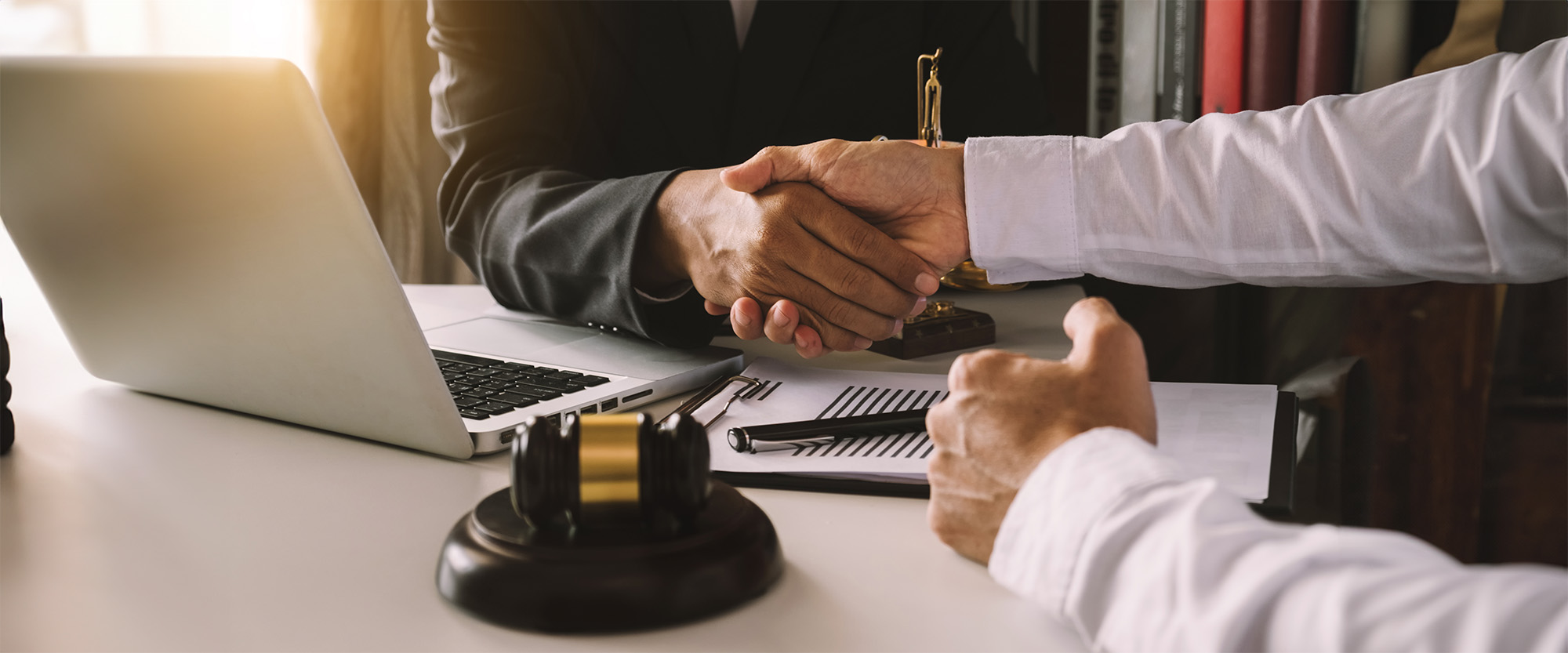 business people and lawyers discussing contract papers sitting at the table
