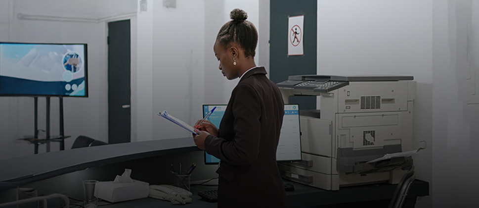 employee reading off a clipboard